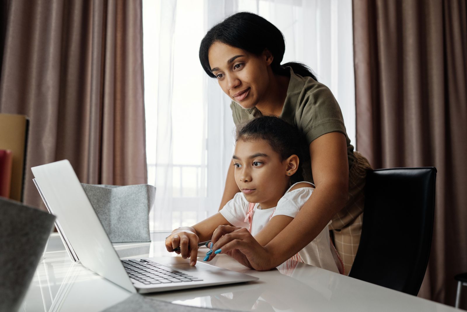 Family using a computer to check information